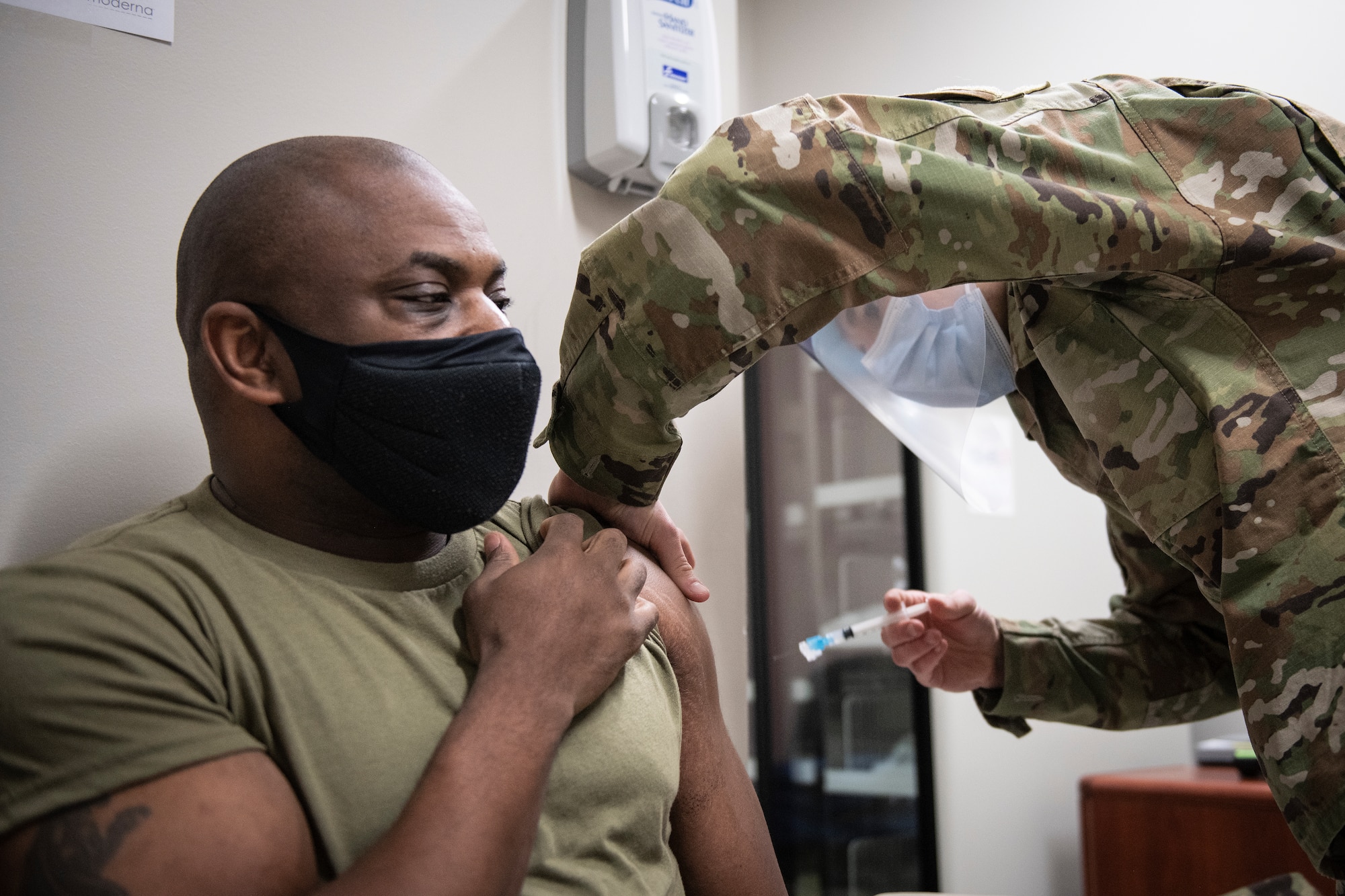 Photo of an Airman getting vaccinated