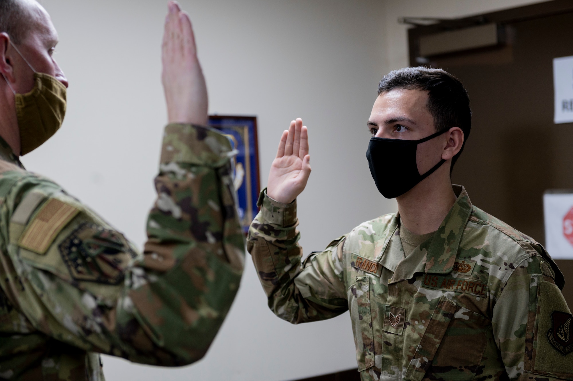 An airmen performs the oath of enlistment