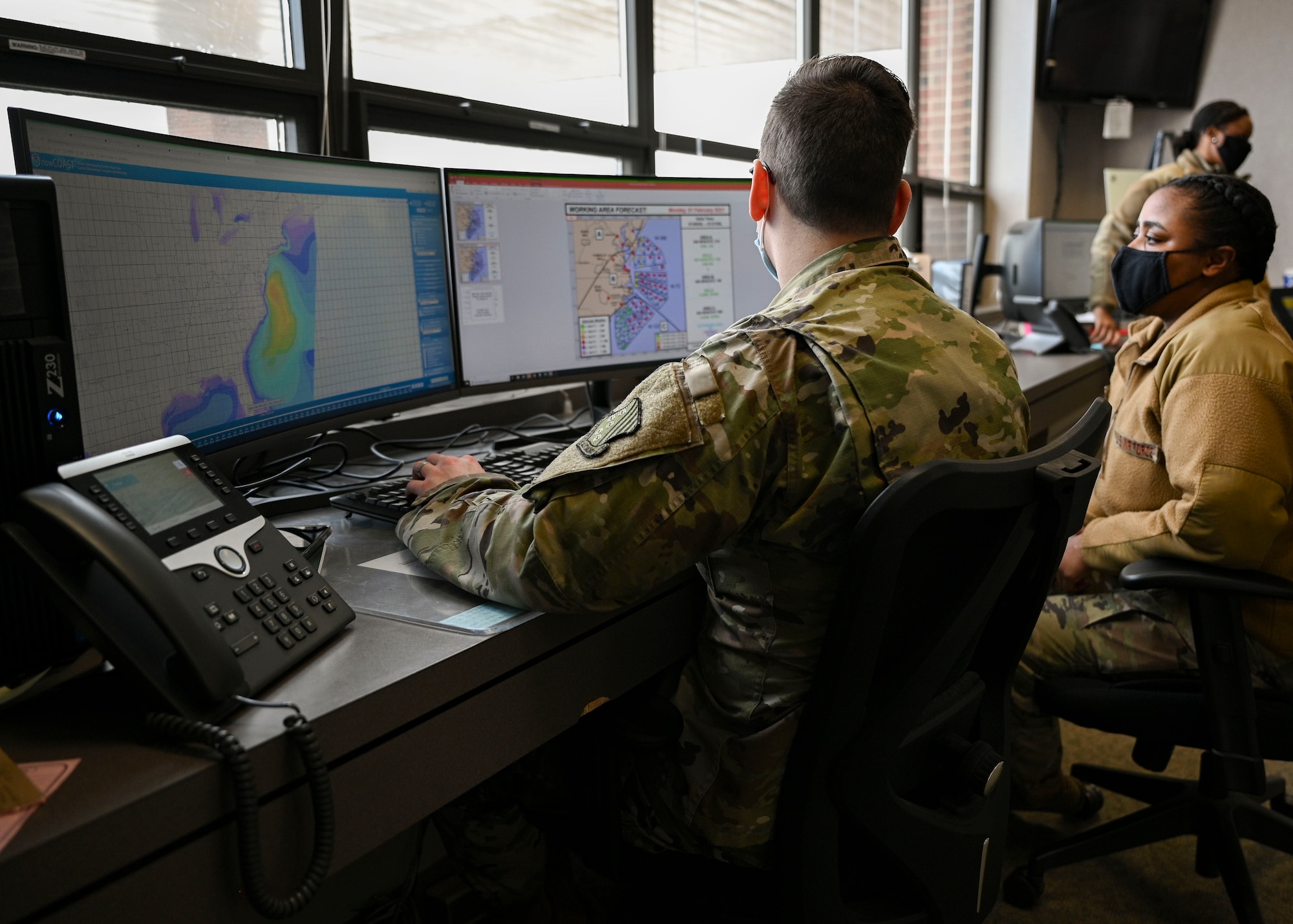 Airmen looking at weather