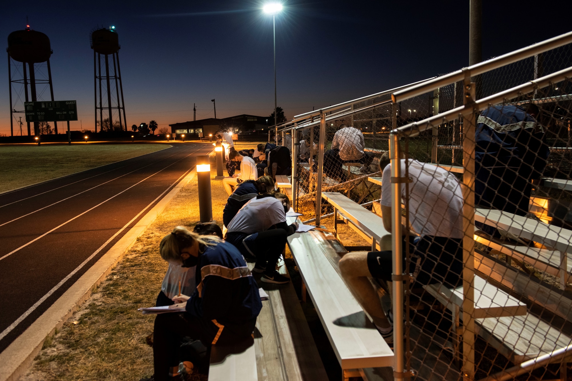 Student pilots filling out forms before starting their morning PT on Feb. 01, 2021 at Laughlin Air Force Base, Texas. During the course the students met at the track for their morning Pt. (U.S. Air Force photo by Airman 1st Class David Phaff)