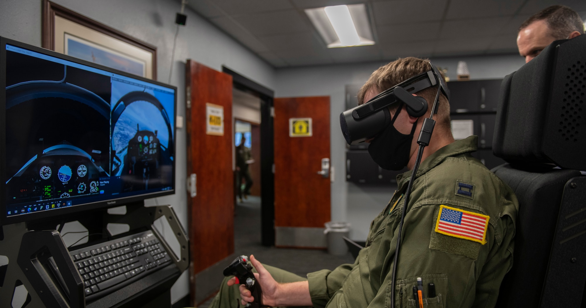U. S. Air Force Capt. Kyle Maloney, a pilot temporarily assigned to the 559th Flying Training Squadron, test flies a T-6 Texan II simulator during an immersive training device evaluation at Joint Base San Antonio-Randolph, Feb. 1, 2021.