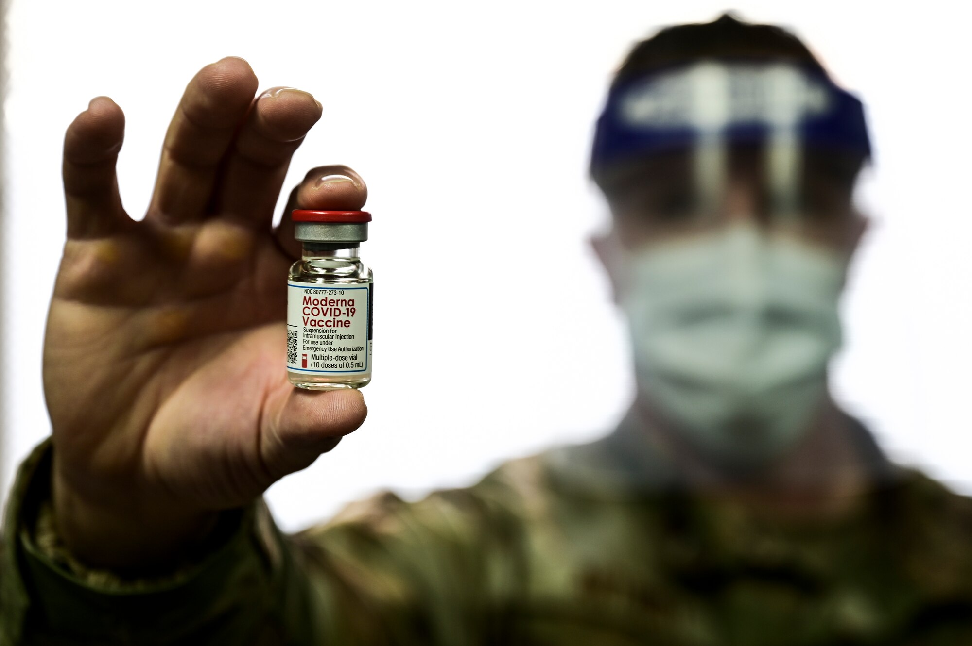 Tech. Sgt. Joseph Anthony, 911th Aeromedical Staging Squadron aeromedical technician, holds a COVID-19 vaccine vial at the Pittsburgh International Airport Air Reserve Station, Pennsylvania, Feb. 4, 2021.