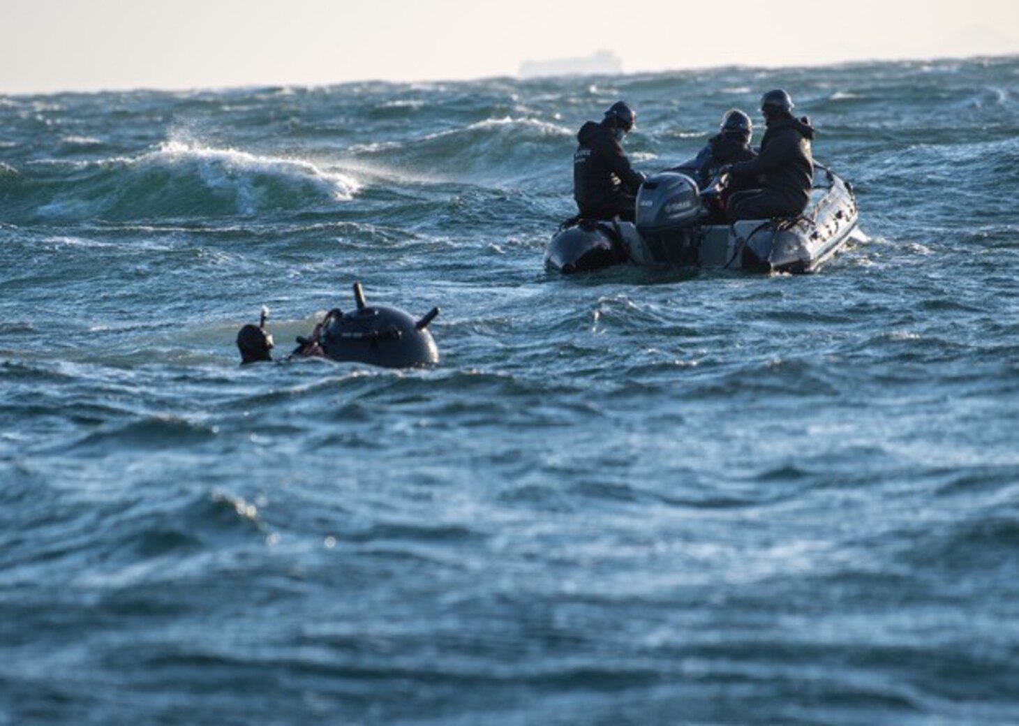 ISE BAY, Japan (Feb. 3, 2021) Explosive Ordnance Disposal Technician 3rd Class Benjamin Loell, deployed with Expeditionary Mine Countermeasures Company 1-1 and employed by MCMRON 7, attaches explosives to a prop-mine during Mine Warfare Exercise (MINEX) 1JA 2021. MINEX 1JA is part of an annual series of exercises between the U.S. Navy and the Japan Maritime Self-Defense Force designed to increase proficiency in mine countermeasure operations. During the nine-day exercise, participants conduct unit-level mine warfare tactics to include mine hunting, detection, and prosecution. (U.S. Navy Photo by Mass Communication Specialist 2nd Class Nick Bauer)