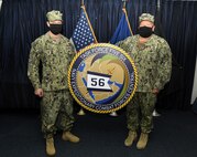 210204-N-UH865-0030 NAVAL SUPPORT ACTIVITY BAHRAIN (Feb. 4, 2021) Capt. Joseph K. Haywood, left, incoming commodore of Commander, Task Force (CTF) 56, and Capt. Stephen J. Jackson, outgoing commodore, conduct a change of command on board Naval Support Activity Bahrain, Feb. 4. CTF 56 is responsible for planning and execution of expeditionary missions in the U.S. 5th Fleet area of operations. The U.S. 5th Fleet area of operations encompasses about 2.5 million square miles of water area and includes the Arabian Gulf, Gulf of Oman, Red Sea and parts of the Indian Ocean. The expanse is comprised of 20 countries and includes three chokepoints, critical to the free flow of global commerce. (U.S. Navy photo by Mass Communication Specialist 1st Class Frank L. Andrews)
