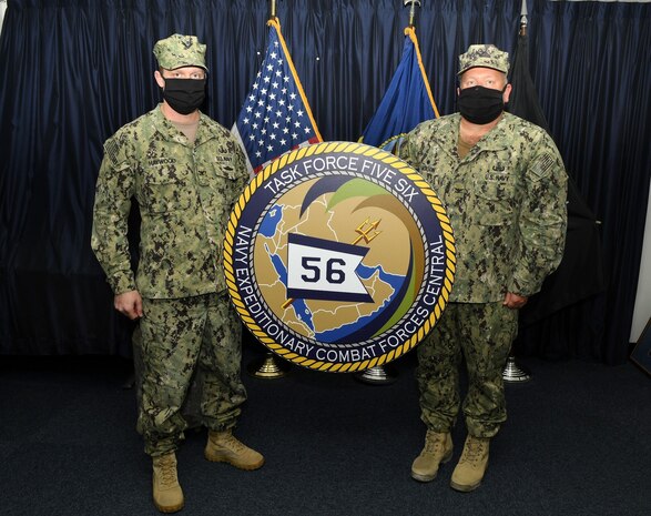 210204-N-UH865-0030 NAVAL SUPPORT ACTIVITY BAHRAIN (Feb. 4, 2021) Capt. Joseph K. Haywood, left, incoming commodore of Commander, Task Force (CTF) 56, and Capt. Stephen J. Jackson, outgoing commodore, conduct a change of command on board Naval Support Activity Bahrain, Feb. 4. CTF 56 is responsible for planning and execution of expeditionary missions in the U.S. 5th Fleet area of operations. The U.S. 5th Fleet area of operations encompasses about 2.5 million square miles of water area and includes the Arabian Gulf, Gulf of Oman, Red Sea and parts of the Indian Ocean. The expanse is comprised of 20 countries and includes three chokepoints, critical to the free flow of global commerce. (U.S. Navy photo by Mass Communication Specialist 1st Class Frank L. Andrews)