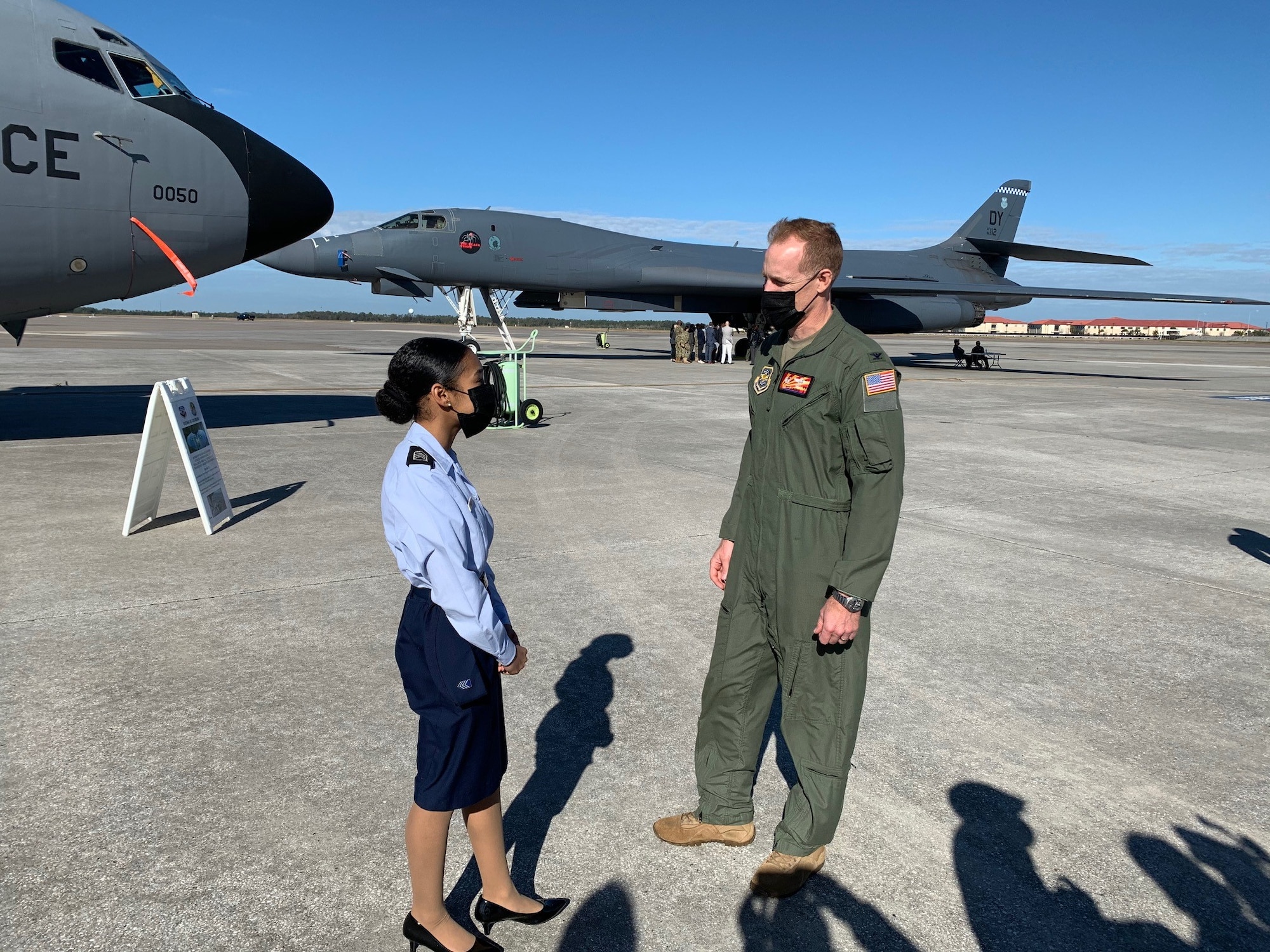 Air Force Col. Benjamin Jonsson, 6th Air Refueling Wing commander, talks with Kaliyah Wilder, a junior at Plant High School, Tampa, Florida, on the MacDill Air Force Base flight line during a tour of a B-1B Lancer bomber and KC-135 Stratotanker aircraft Feb. 5, 2021. Tampa Bay students visited MacDill AFB to learn about the Air Force aircraft scheduled to fly over Raymond James Stadium during Super Bowl LV. The tour provided both male and female students from diverse multi-ethnic backgrounds in the community the opportunity to learn about the Air Force mission while sitting in the aircraft’s cockpit and visualizing themselves soaring at 35,000 feet in the air. (U.S. Air Force photo by Terry Montrose)