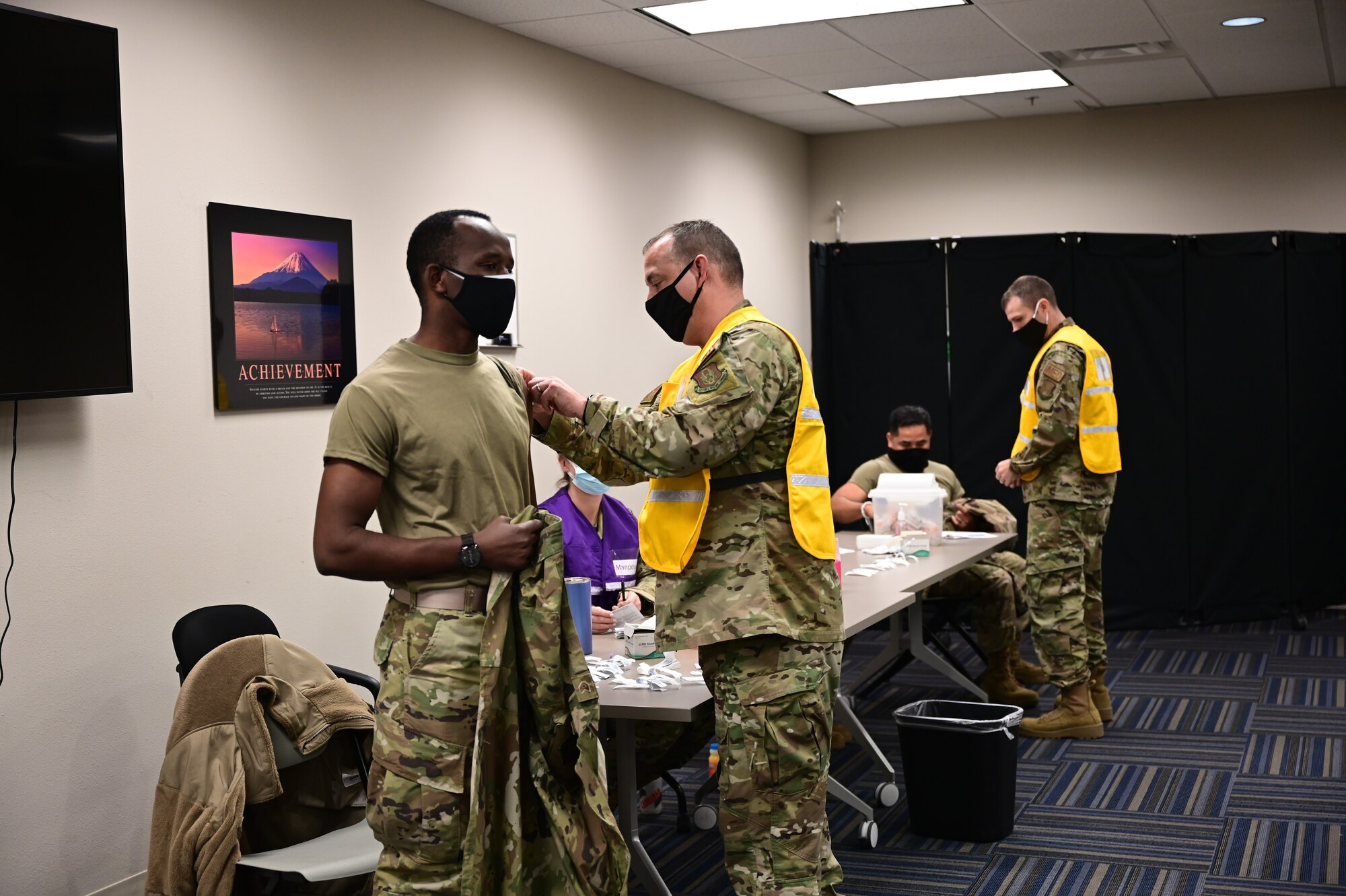 Air Force Reserve members from the 913th Airlift Group voluntarily receive the Moderna COVID19 vaccine from fellow reserve medical professionals at Little Rock Air Force Base, Ark., Feb. 7, 2021.The two-dose vaccines were recently approved by the Food and Drug Administration under an emergency use authorization and are currently offered to DoD personnel on a voluntary basis.  (U.S. Air Force  photo by Airman 1st Class Julia Ford)