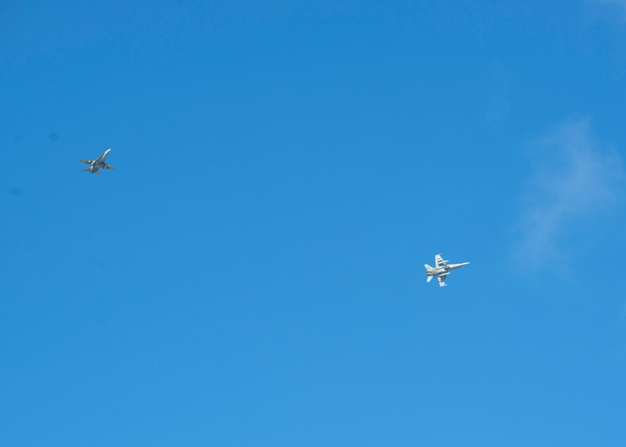 Two F-16CJ Fighting Falcons fly during a group flight line engagement for Exercise Cope North 2021 at Andersen Air Force Base, Guam, Feb.5, 2021. Exercise Cope North 2021 is an annual U.S. Pacific Air Forces joint/combined, trilateral field training exercise occurring Feb. 3-19, 2021.The exercise includes participants from the U.S. Air Force, U.S. Navy, U.S. Marine Corps, Japan Air Self-Defense Force and Royal Australian Air Force conducted primarily at Andersen AFB. (U.S. Air Force photo by Senior Airman Aubree Owens)