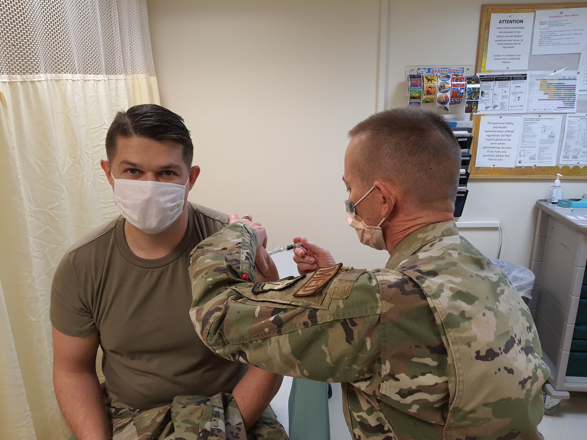 Senior Airman Chris Johns, 403rd Maintenance Squadron sheet metal technician, received his flu shot vaccine from Lt. Col. Randy McKee, 403rd Aeromedical Staging Squadron nurse, Feb. 6, 2021. The 403rd ASTS is responsible for ensuring that the Reserve Citizen Airmen of the 403rd Wing are current or 'green' on their Individual Medical Readiness status; which includes providing immunizations, optometry services, dental x-rays and exams, lab draws, audiograms, and physicals. (U.S. Air Force photo by Master Sgt. Jessica Kendziorek/ photo permission granted by Senior Airman Chris Johns)