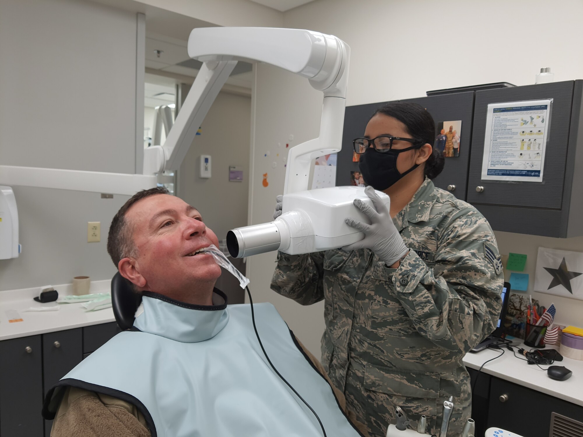 Tech. Sgt. Travis Walters, 403rd Aircraft Maintenance Squadron electro environmental specialist, has dental x-rays taken by Senior Airman Ariana Ambrocio, 403rd Aeromedical Staging Squadron dental assistant technician, Feb. 6, 2021. The 403rd ASTS is responsible for ensuring that the Reserve Citizen Airmen of the 403rd Wing are current or 'green' on their Individual Medical Readiness status; which includes providing immunizations, optometry services, dental x-rays and exams, lab draws, audiograms, and physicals. (U.S. Air Force photo by Master Sgt. Jessica Kendziorek/ photo permission granted by Tech. Sgt. Travis Walters)