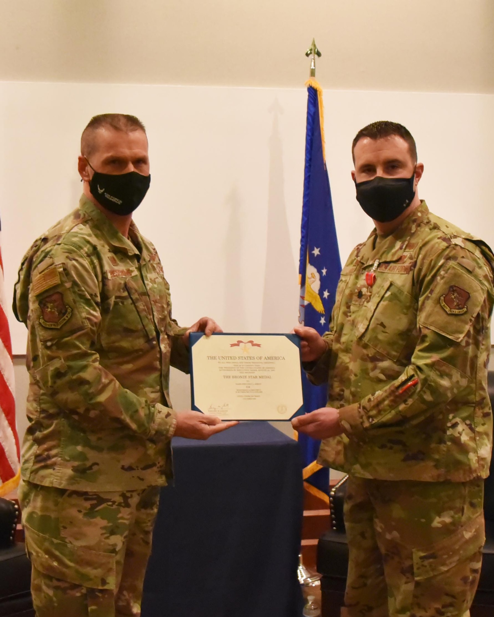 Col. Phil Heseltine, 931st Air Refueling Wing commander, presents the Bronze Star to Lt. Col. Johnathan Jordan, 931st Maintenance Squadron commander, Feb. 5, 2021, at McConnell Air Force Base, Kansas. Jordan received the decoration for his leadership during the Iran missile strike while deployed at Al Asad Air Base in January 2020.