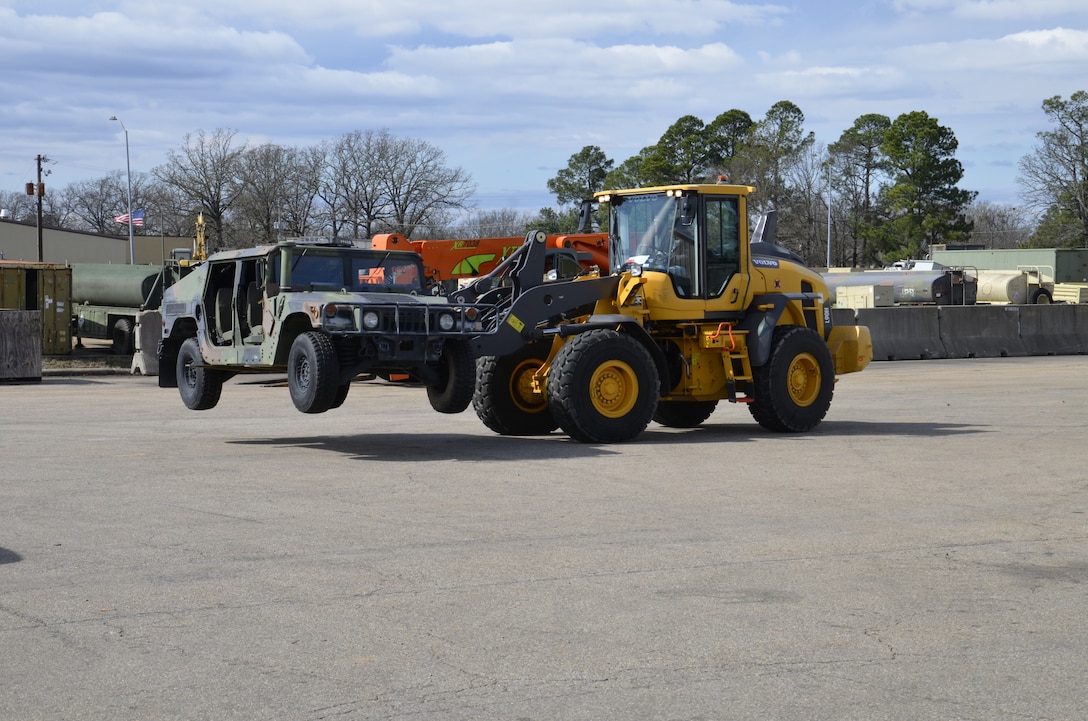 Dennis Keener, one of the 116 team members honored, operates a forklift to unload a Hummer turned into the Defense Logistics Agency Disposition Services at Red River, Texas, Feb. 25, 2020