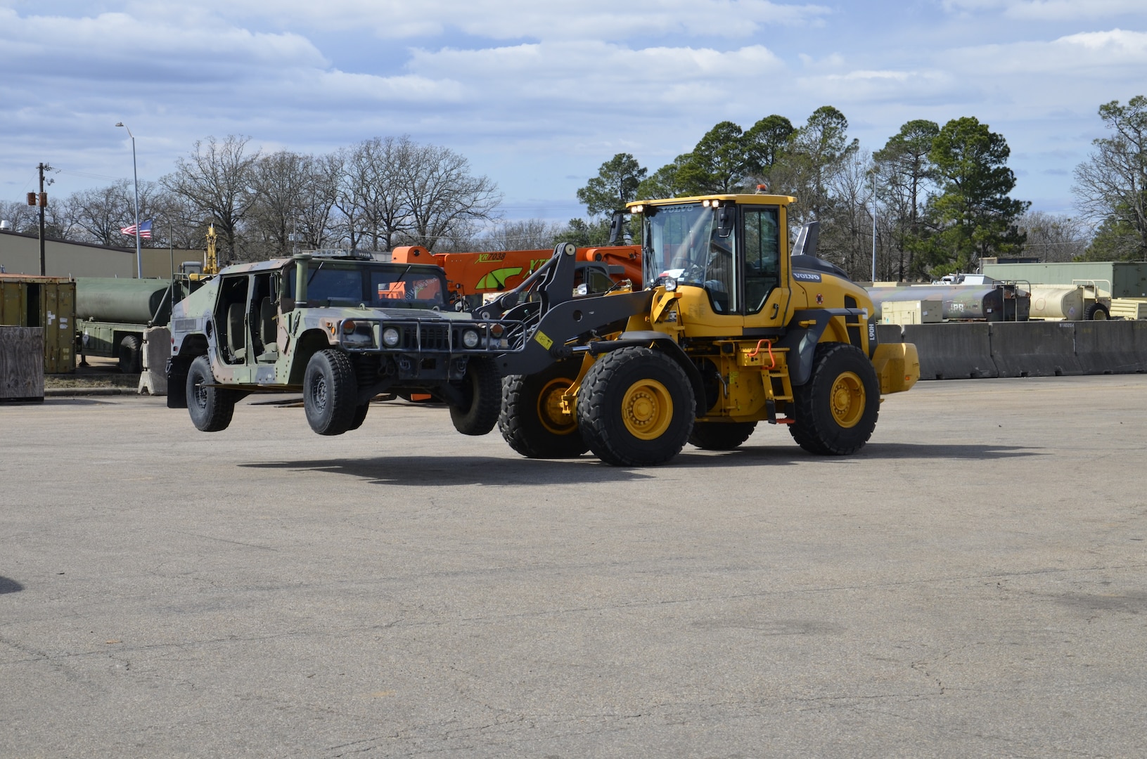 Dennis Keener, one of the 116 team members honored, operates a forklift to unload a Hummer turned into the Defense Logistics Agency Disposition Services at Red River, Texas, Feb. 25, 2020