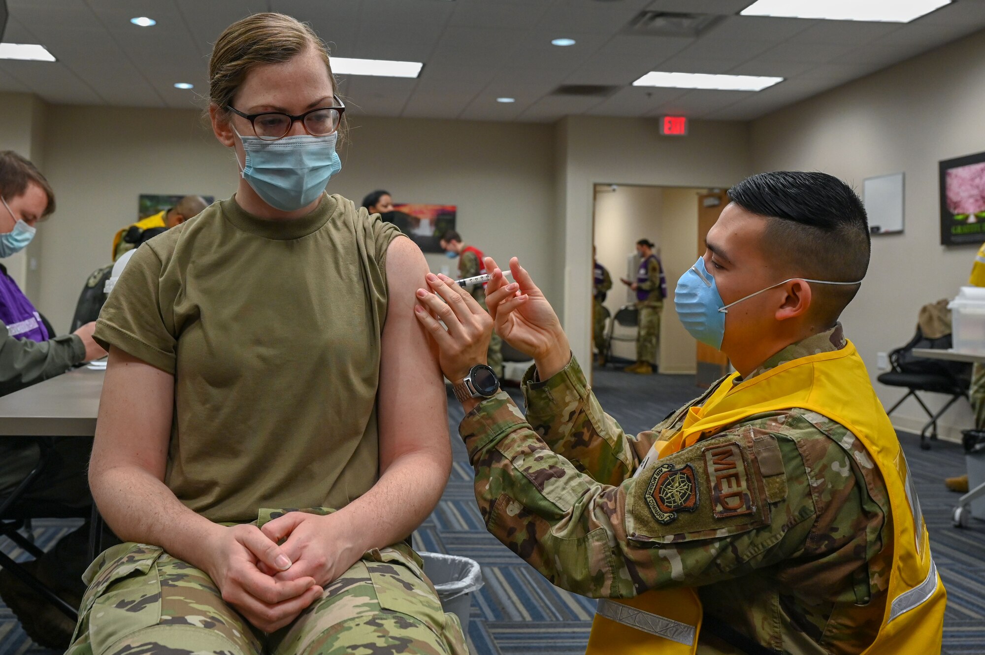 A woman receives the COVID-19 vaccine