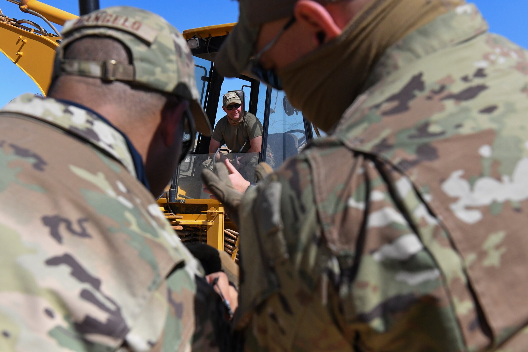 U.S. Air Force Master Sgt. Sean Kerrigan, 724th Expeditionary Air Base Squadron Civil Engineer Flight water and fuels maintenance shop supervisor, takes a break while his colleagues assess the location of a water main break at Nigerien Air Base 201, Agadez, Niger, Feb. 2, 2021. The civil engineer flight worked to successfully locate a water main break on the logistics readiness flight compound. (U.S. Air Force photo by Senior Airman Gabrielle Winn)