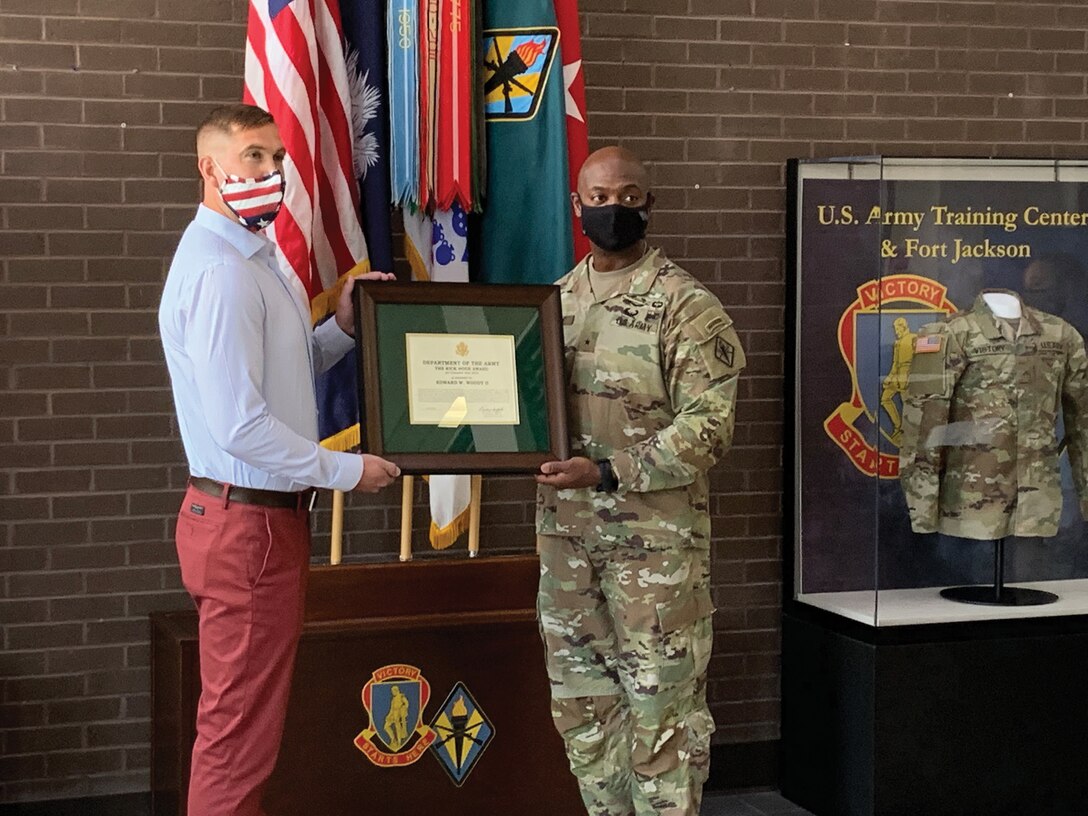Capt. Edward (Bill) W. Woody II, left, accepts the Nick Hoge Award from Brig. Gen. Milford Beagle Jr., Commanding General for the U.S. Army Training Center, Fort Jackson, South Carolina. Woody works as a management support specialist with the 165th Infantry Brigade at Fort Jackson, and he is also a traditional reservist in the 445th Aeromedical Staging Squadron at Wright-Patterson Air Force Base, Ohio. (Courtesy photo)