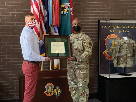 Capt. Edward (Bill) W. Woody II, left, accepts the Nick Hoge Award from Brig. Gen. Milford Beagle Jr., Commanding General for the U.S. Army Training Center, Fort Jackson, South Carolina. Woody works as a management support specialist with the 165th Infantry Brigade at Fort Jackson, and he is also a traditional reservist in the 445th Aeromedical Staging Squadron at Wright-Patterson Air Force Base, Ohio. (Courtesy photo)