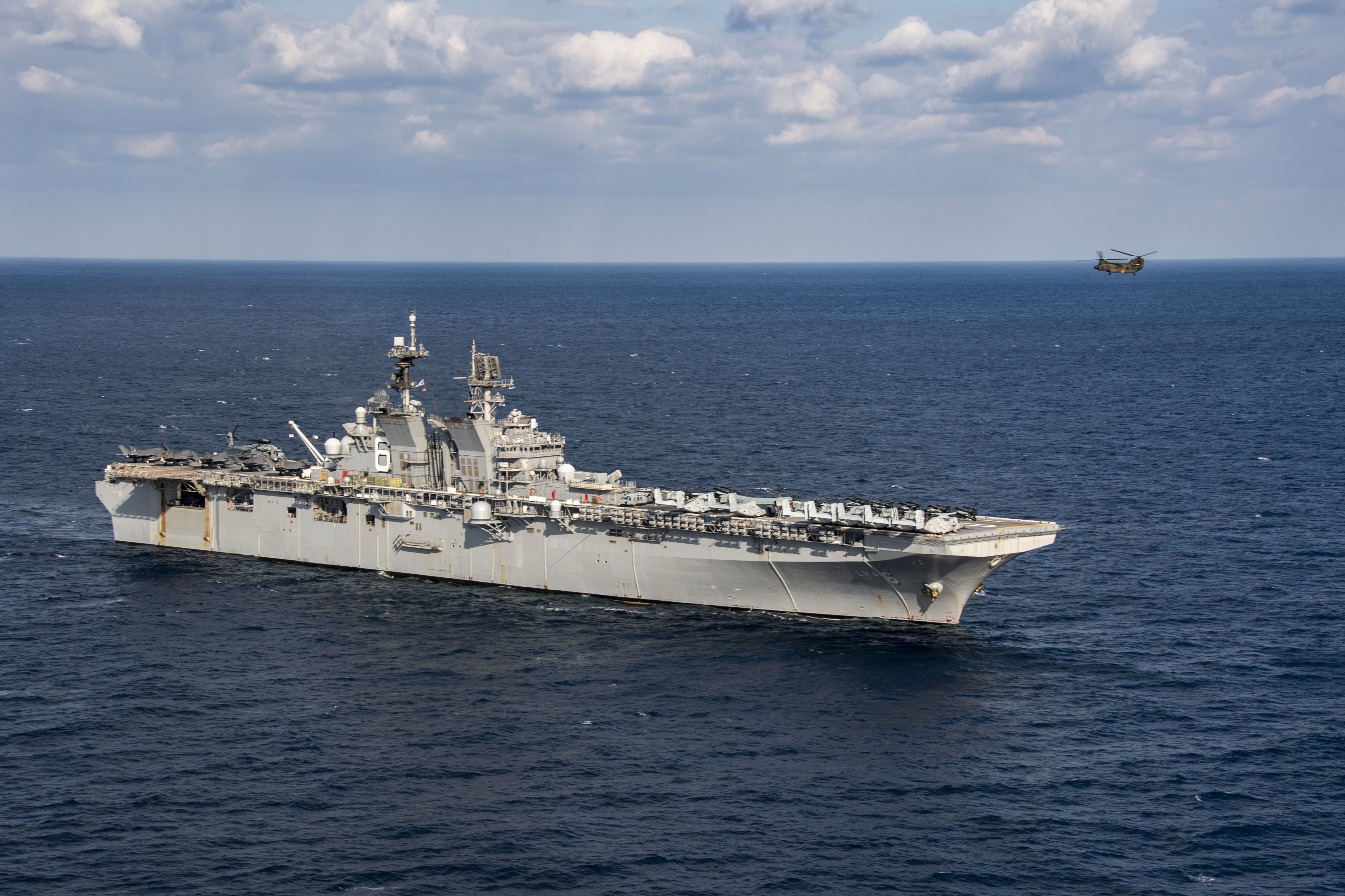 A CH-47 Chinook helicopter from the Japan Ground Self-Defense Force, 1st Helicopter Brigade, lands aboard the forward-deployed amphibious assault ship USS America (LHA 6) during joint integrated flight operations.