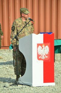Lt. Col. Jason Osberg, of Champaign, Illinois, Commander, Bilateral Embedded Support Team (BEST) A25, addresses the Polish military contingent during the Illinois Army National Guard (ILARNG) BEST decommissioning ceremony at Bagram Airfield, Afghanistan.