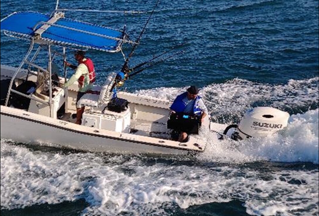 The crew of a distressed boat uses a trash can to dump water from their small boat taking on water off the coast of
Florida. The trash can was provided from a crew from the U.S. Army Corps of Engineers, Jacksonville District survey vessel Florida II who assisted the U.S.Coast Guard in the rescue. The Florida II crew was conducting a routine hydrographic survey offshore near Cape Canaveral and
responded to a “MAYDAY” call.
(USACE photo by Jayce Evans)