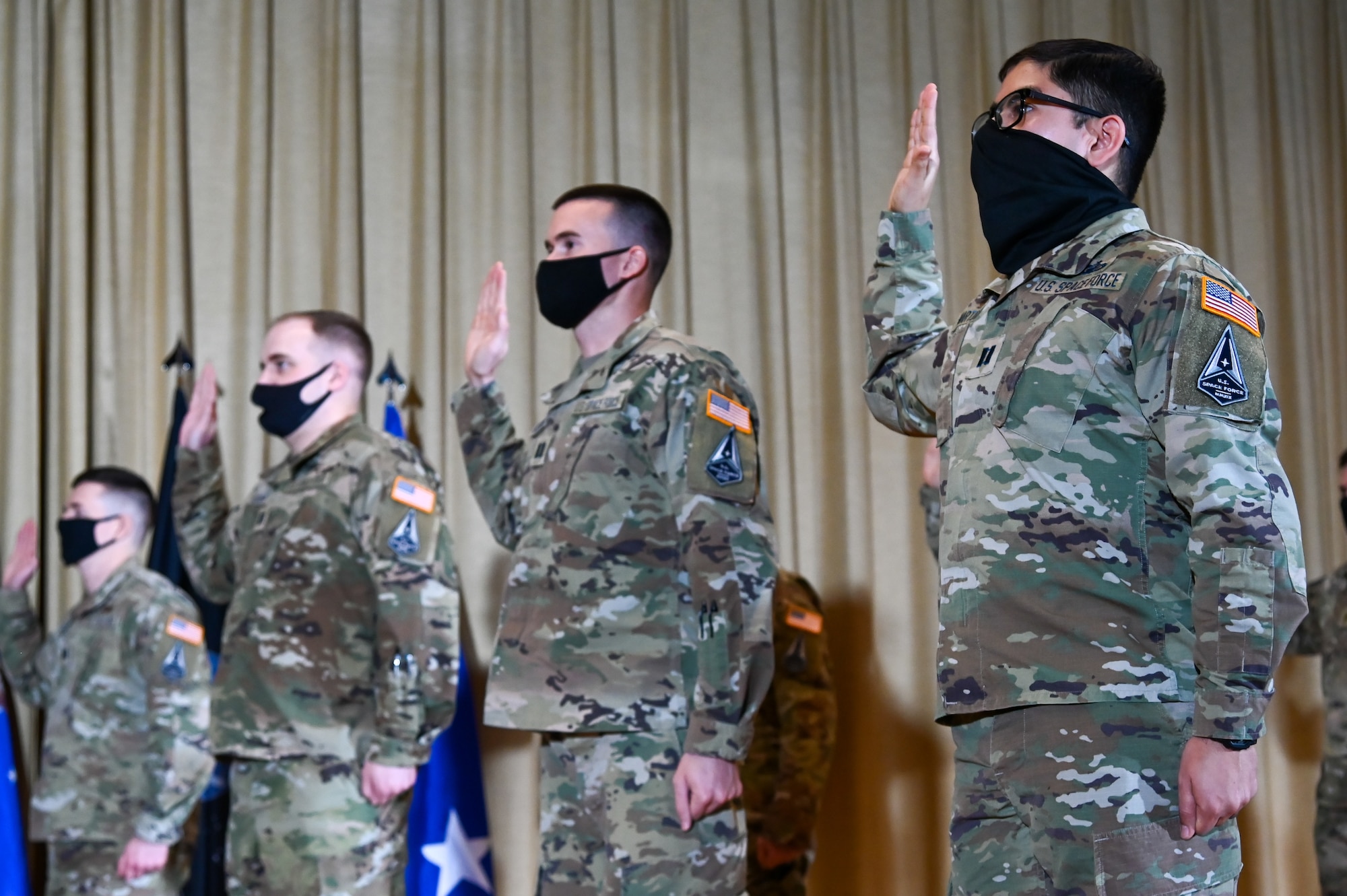 Officer inductees give the Oath of Office at the U.S. Space Force Induction Ceremony, Feb. 5, 2021