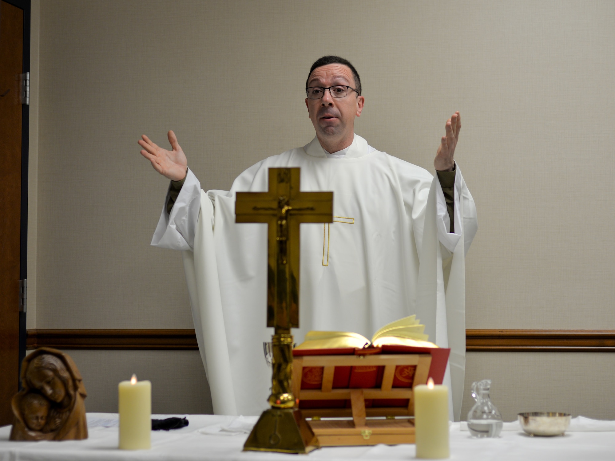U.S. Air Force Chaplain (Capt.) Pedro Jimenez Barros, a 446th Airlift Wing chaplain, leads mass using online streaming during unit training assembly Jan. 10, 2021 at Joint Base Lewis-McChord, Washington.