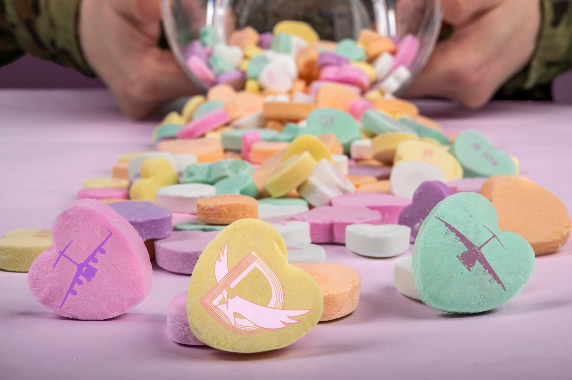 This Valentine’s Day photo illustration was created to wish everyone a safe and happy Valentine’s Day from the 436th Airlift Wing at Dover Air Force Base, Delaware. (U.S. Air Force photo illustration by Senior Airman Christopher Quail) (This image was created by making the tabletop lavender, adding the Dover Air Force Base symbol, a C-17 Globemaster III and C-5 Super Galaxy design.)