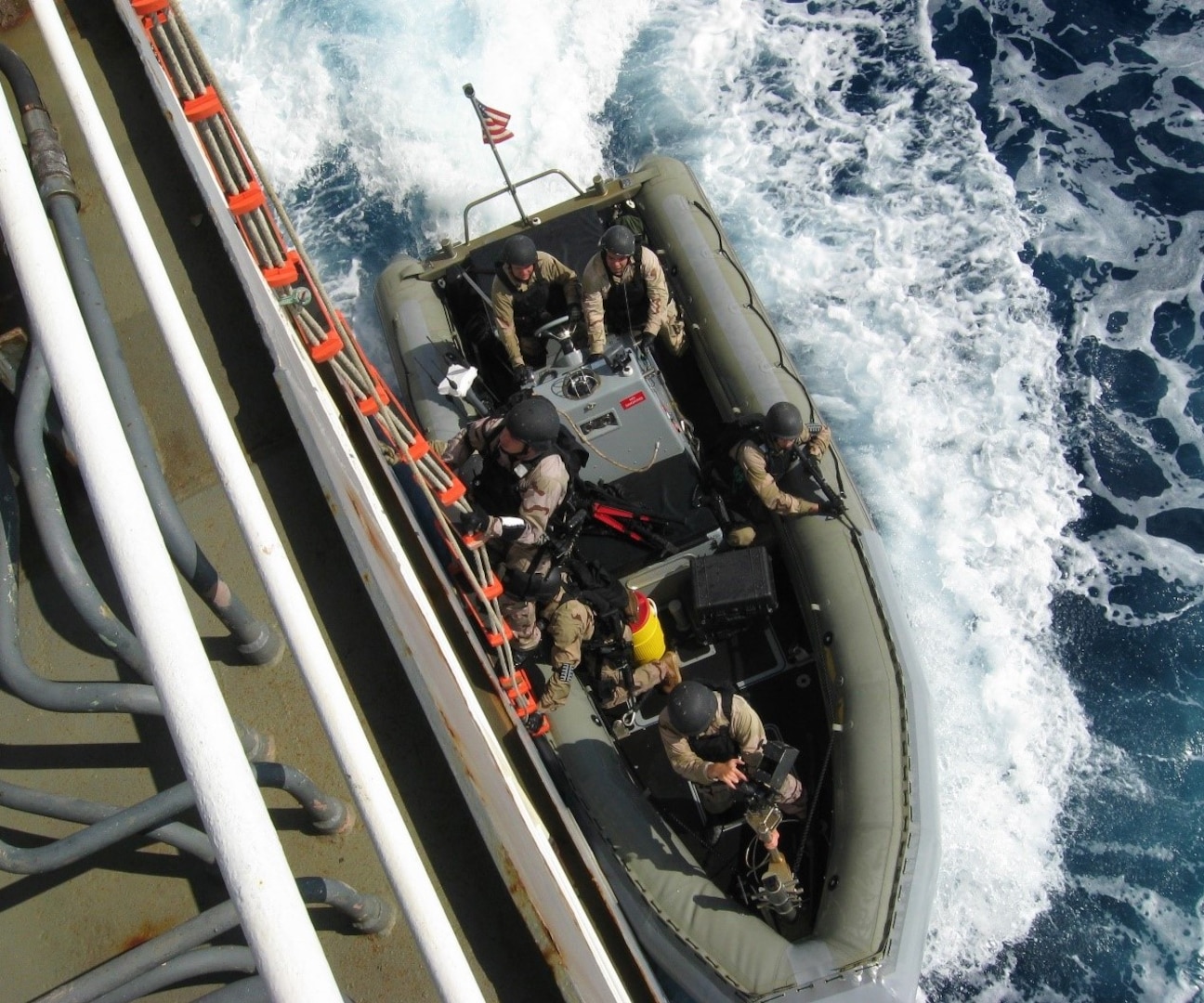 IMAGE: NORFOLK, Va. – A Navy visit, board, search, seizure (VBSS) team boards a ship during training supported by the Naval Surface Warfare Center Dahlgren Division (NSWCDD) Identity Dominance System (IDS) Mobile Training Team. The system – to be upgraded with a Dahlgren-developed IDS technology refresh in fiscal 2021 – collects biometrics such as face, finger, and iris images, and enrolls that information into a local database to match against known persons of interest. Once the information has been captured, the system sends the information back to the authoritative database. Since the outbreak of COVID-19, NSWCDD scientists and engineers transitioned to telework while developing software in support of a complete technology refresh focused on modifying the IDS form factor to be smaller and lighter with an enhanced system performance that increases computing power, speed, local matching and communications capabilities.  (U.S. Navy photo/Released)