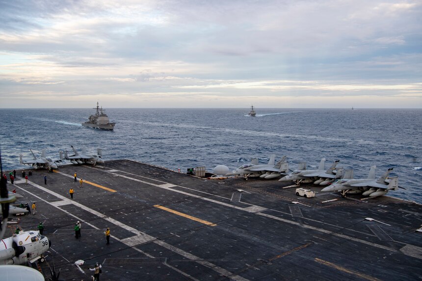 SOUTH CHINA SEA (Feb. 9, 2021) – The Nimitz Carrier Strike Group moves into formation with the Theodore Roosevelt Carrier Strike Group in the South China Sea Feb. 9, 2021. The Theodore Roosevelt and Nimitz Carrier Strike Groups are conducting dual-carrier operations during their deployments to the 7th Fleet area of operations. As the U.S. Navy's largest forward-deployed fleet, 7th Fleet routinely operates and interacts with 35 maritime nations while conducting missions to preserve and protect a free and open Indo-Pacific Region. (U.S. Navy photo by Mass Communication Specialist Seaman Deirdre Marsac)