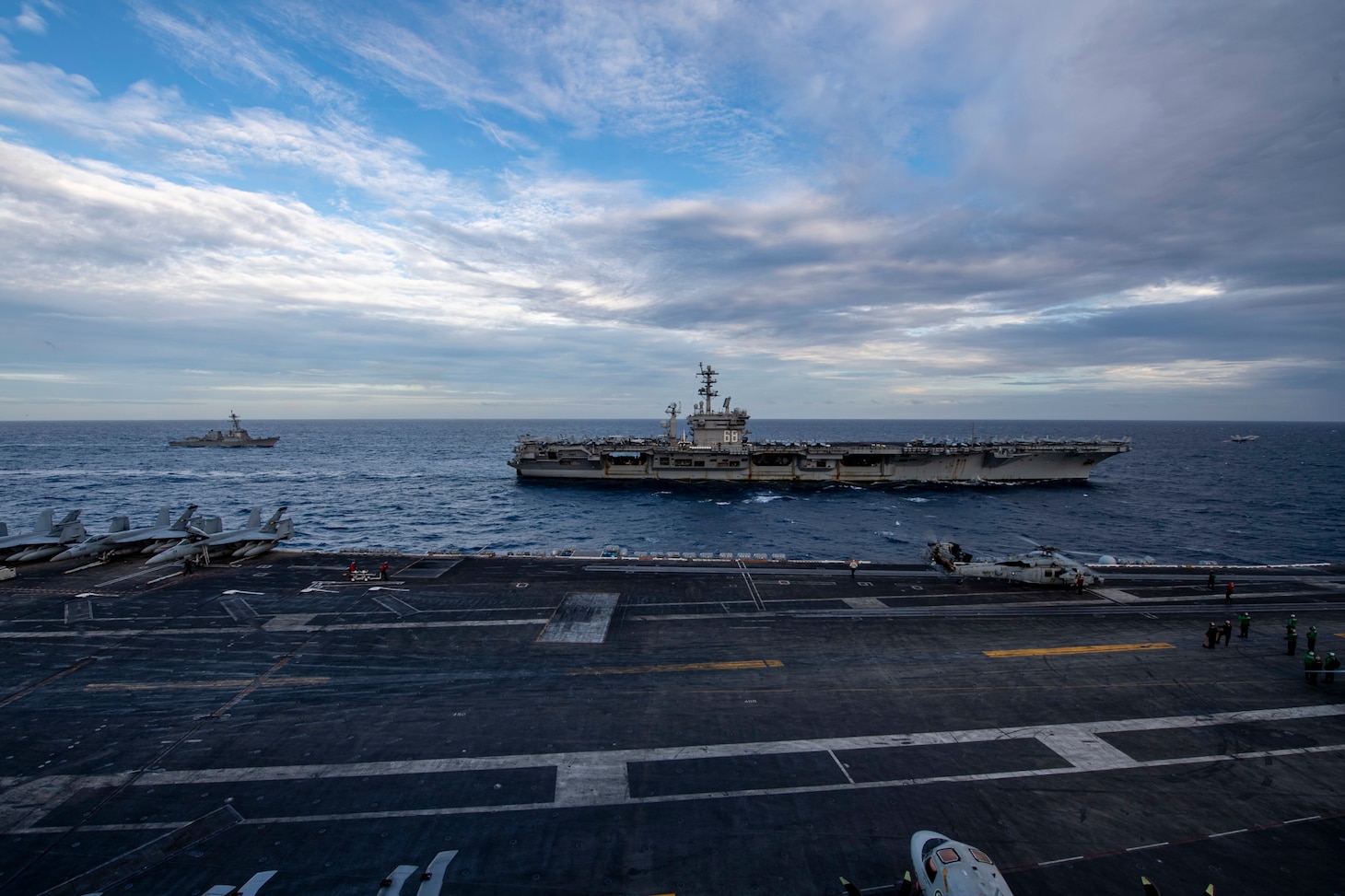 SOUTH CHINA SEA (Feb. 9, 2021) – The Theodore Roosevelt Carrier Strike Group transits in formation with the Nimitz Carrier Strike Group in the South China Sea Feb. 9, 2021. The Theodore Roosevelt and Nimitz Carrier Strike Groups are conducting dual-carrier operations during their deployments to the 7th Fleet area of operations. As the U.S. Navy's largest forward-deployed fleet, 7th Fleet routinely operates and interacts with 35 maritime nations while conducting missions to preserve and protect a free and open Indo-Pacific Region. (U.S. Navy photo by Mass Communication Specialist Seaman Deirdre Marsac)