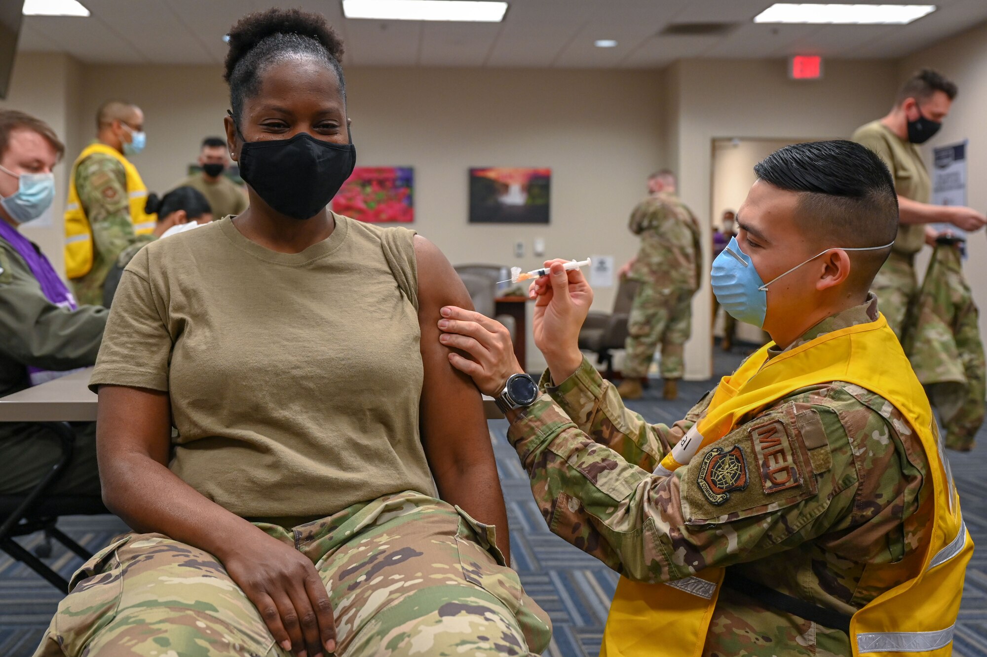 A woman receives the COVID-19 vaccine