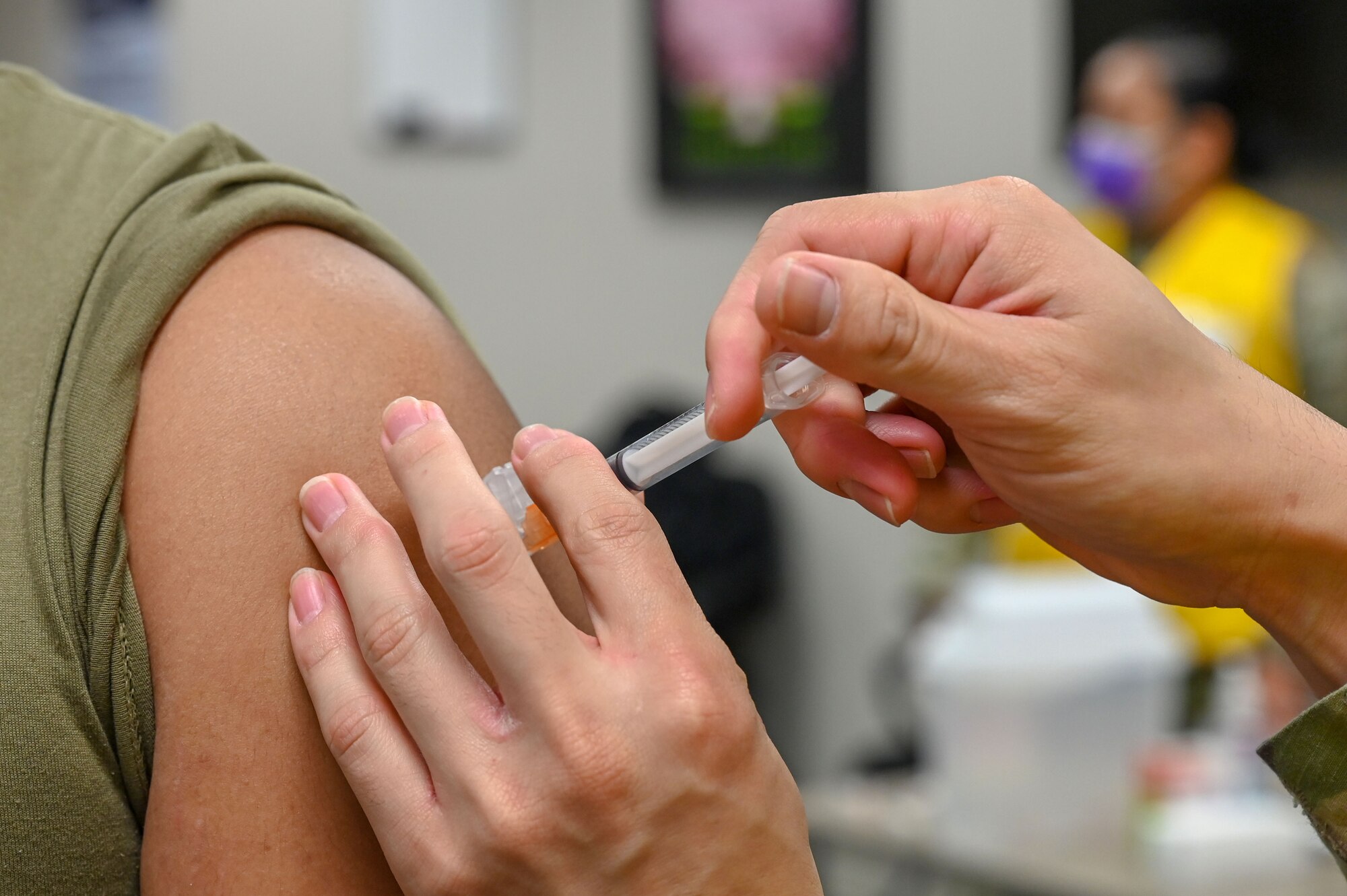 A man receives the COVID-19 vaccine