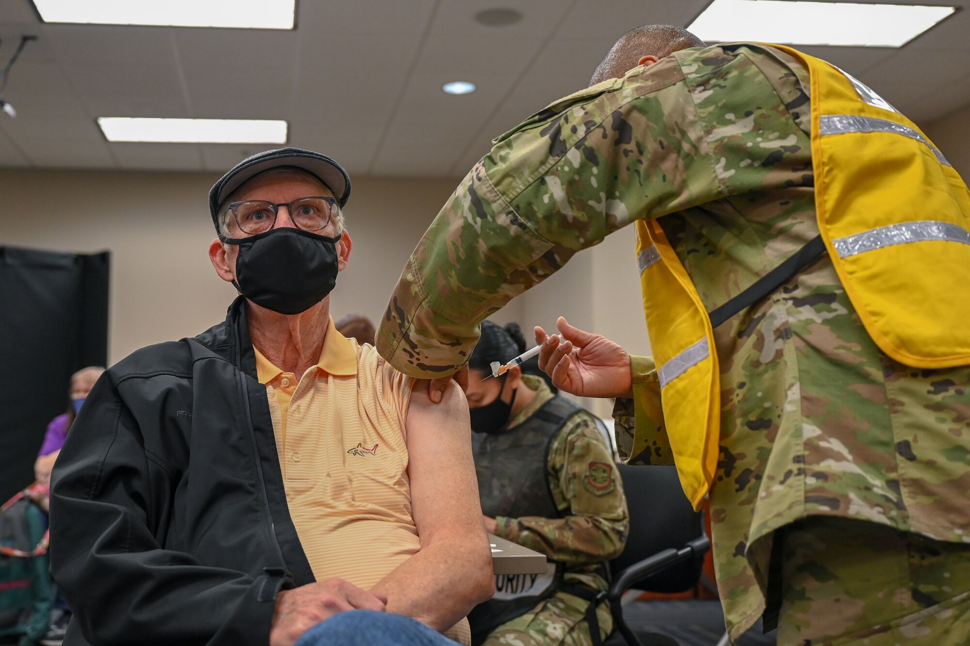 A man receives the COVID-19 vaccine