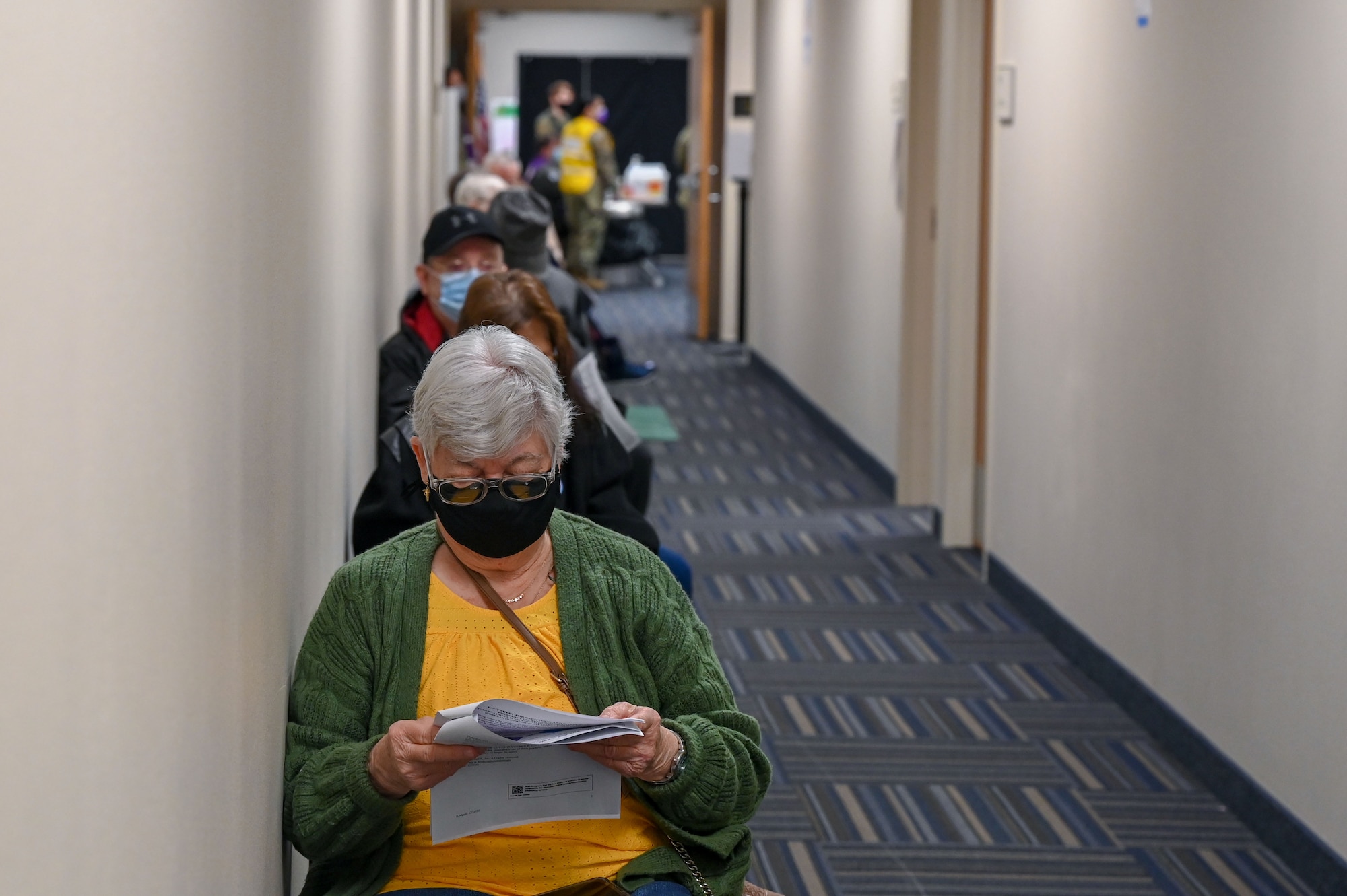 People wait in a hallway