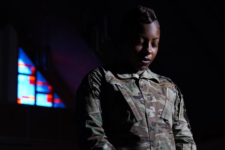 U.S. Air Force Senior Master Sgt. Jessica Player, Mathies NCO Academy director of education, takes time to give thanks inside the Larcher Chapel at Keesler Air Force Base Dec. 10, 2020. As a practicing Muslim, Player follows her faith to help strengthen her purpose. (U.S. Air Force photo by Airman 1st Class Seth Haddix)