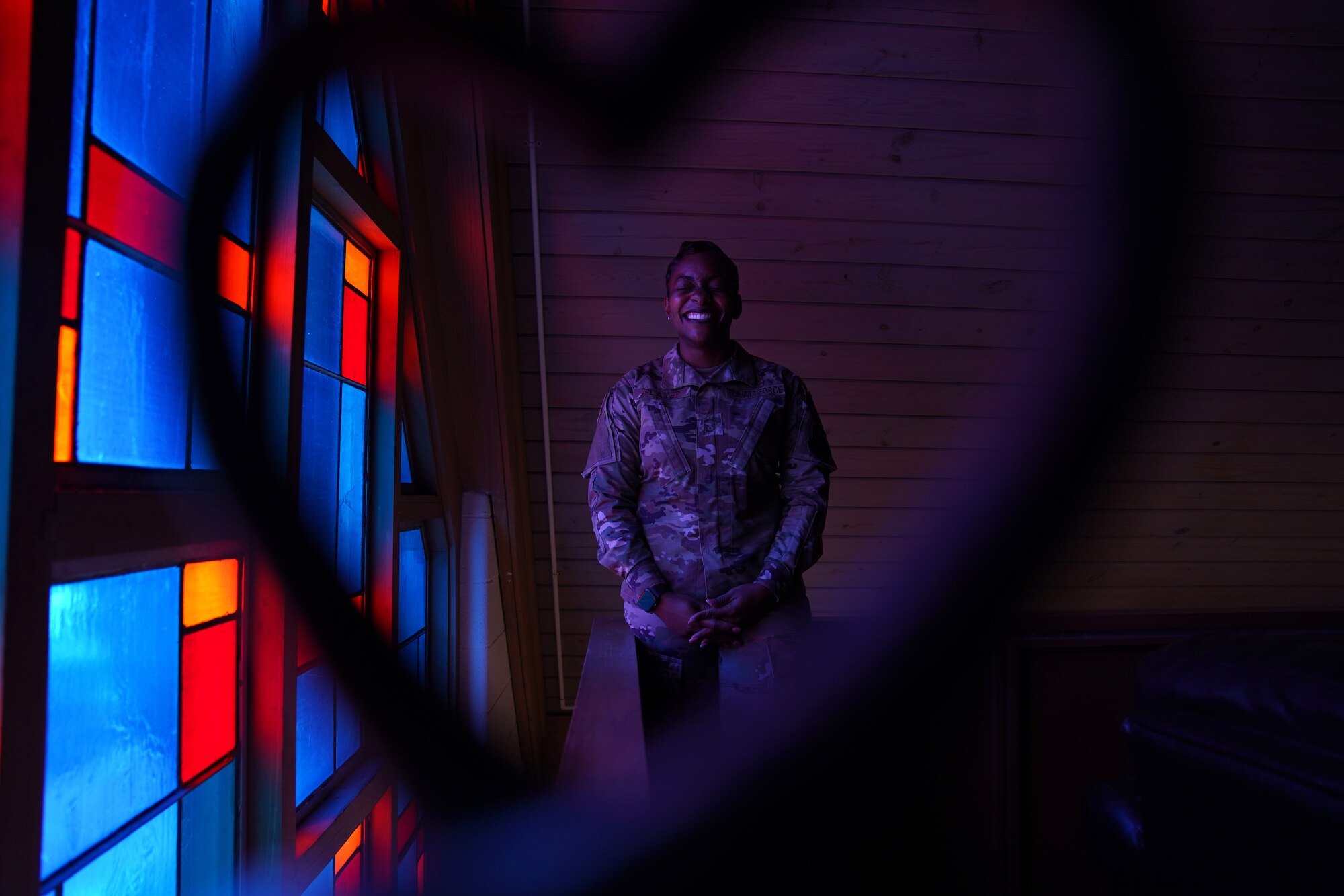 U.S. Air Force Senior Master Sgt. Jessica Player, Mathies NCO Academy director of education, laughs at a joke inside the Larcher Chapel at Keesler Air Force Base Dec. 10, 2020. As a practicing Muslim, Player follows her faith to help strengthen her purpose. (U.S. Air Force photo by Airman 1st Class Seth Haddix)