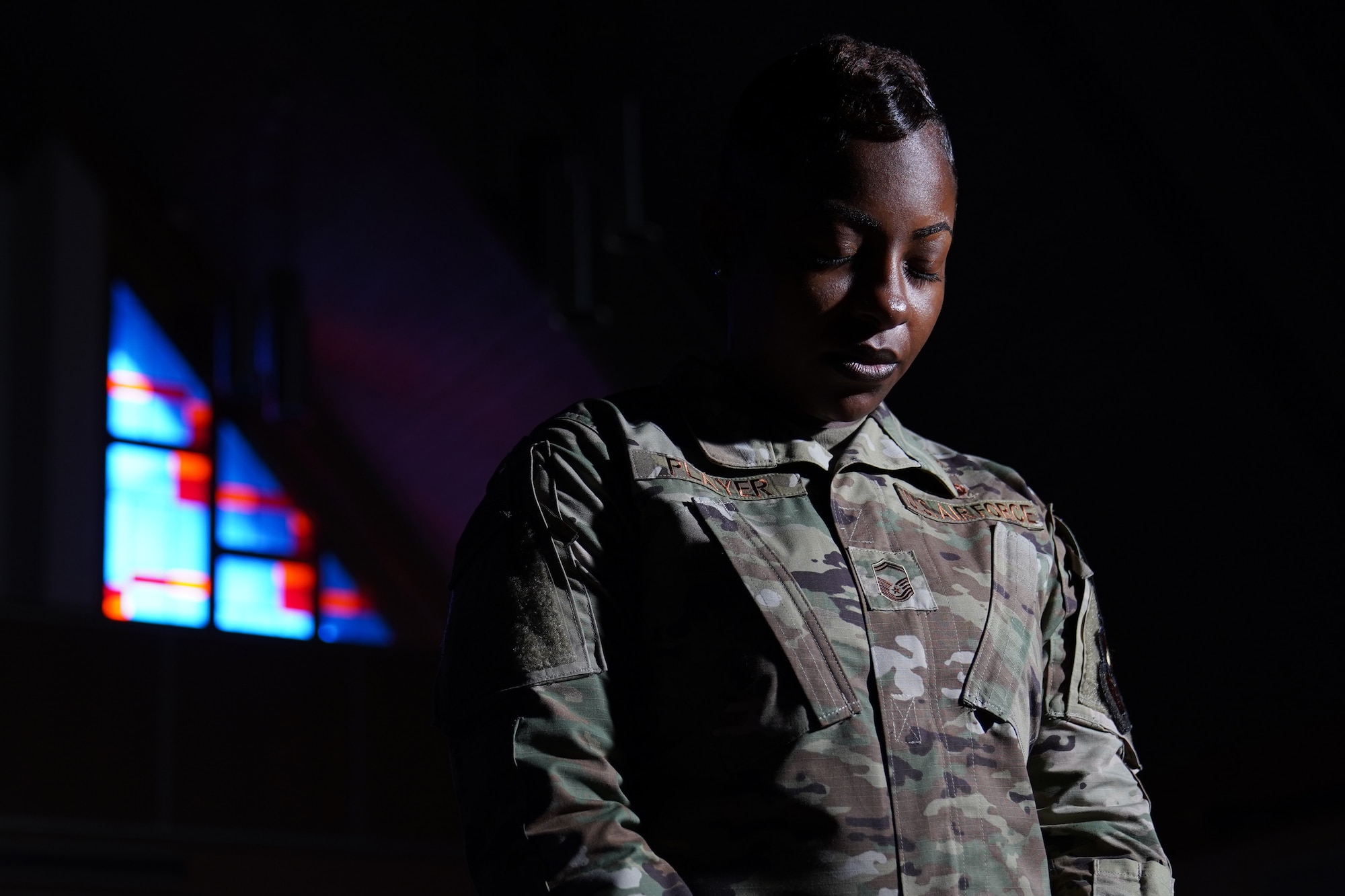 U.S. Air Force Senior Master Sgt. Jessica Player, Mathies NCO Academy director of education, takes time to give thanks inside the Larcher Chapel at Keesler Air Force Base Dec. 10, 2020. As a practicing Muslim, Player follows her faith to help strengthen her purpose. (U.S. Air Force photo by Airman 1st Class Seth Haddix)