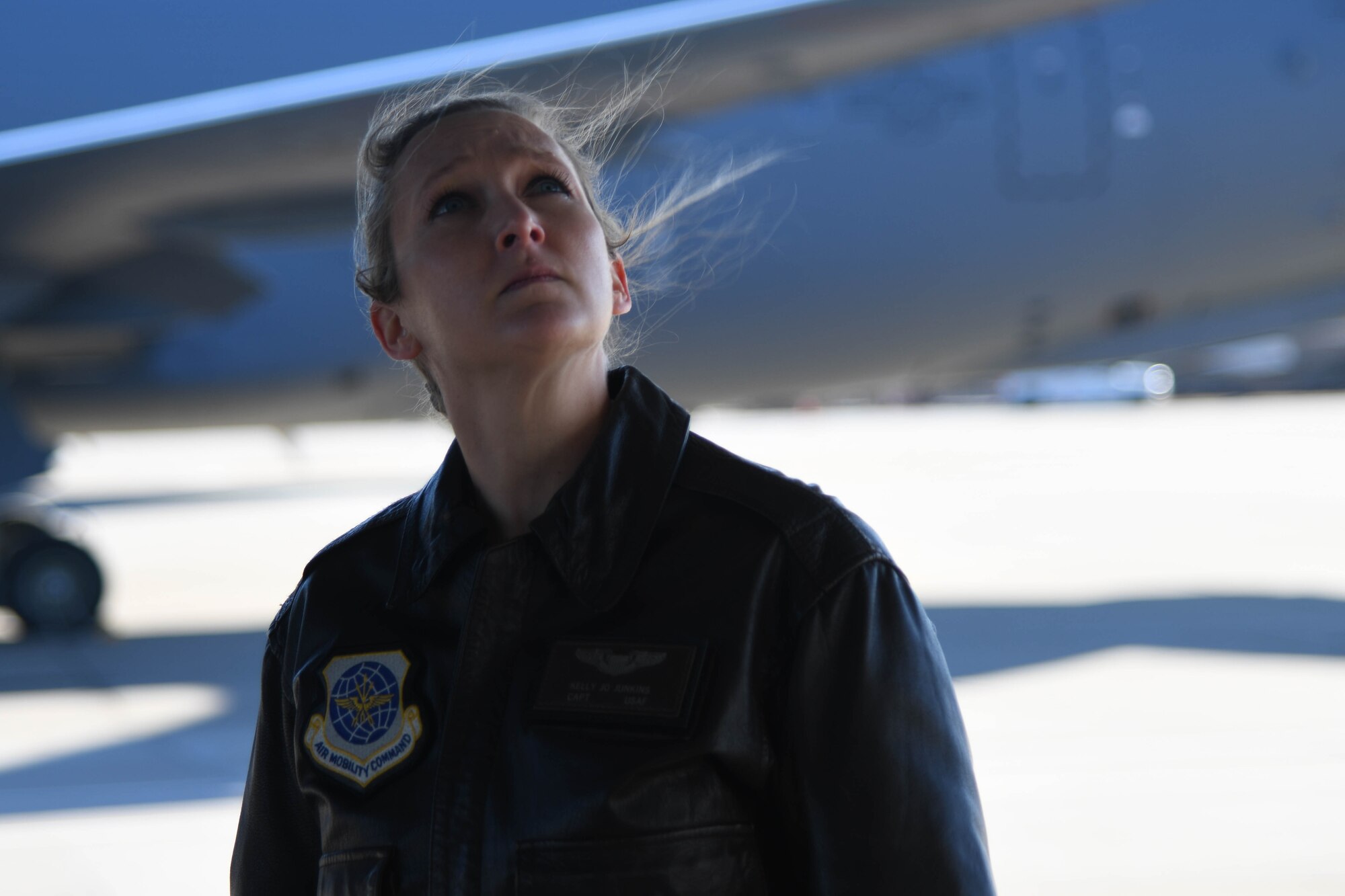 Maj. Kelly Junkins, 22nd Operation Support Squadron deputy chief of current operations, inspects the exterior of a KC-46 Pegasus before a flight Jan. 22, 2021, at McConnell Air Force Base, Kansas. Jackson was one of seven pilots from McConnell that flew to United States Air Force Academy in support of the academy’s initiative to increase the number of women and minorities joining rated career fields. (United States Air Force photo by Senior Airman Nilsa Garcia)