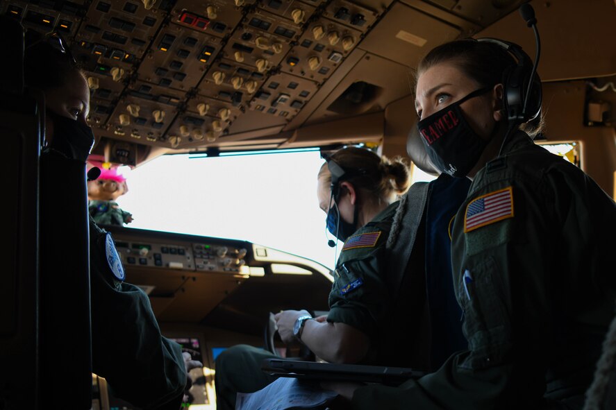 Maj. Victoria McBride, Head Quarters Air Mobility Command KC-46 simulator certification pilot, Capt. Kristi Miner, 22nd Air Refueling Wing executive officer, and Capt. Michelle McMillen, 22nd Operations Group executive officer, perform pre-flight checks Jan. 22, 2021, at McConnell Air Force Base, Kansas. As of Oct. 2020, only about 838 female Airmen served as pilots, according to the Air Force Personnel Center officials. (United States Air Force photo by Senior Airman Nilsa Garcia)