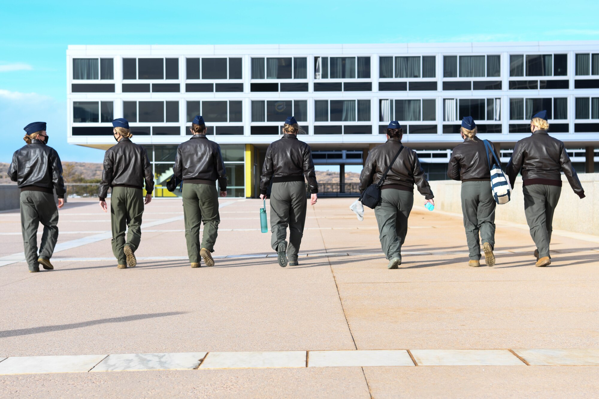 The aircrew from the first all-female flight of the KC-46 Pegasus walk the grounds of the United States Air Force Academy Jan. 22, 2021, in Colorado Springs, Colorado. The team sought to break down cultural and personal barriers female cadets face when competing for pilot training slots. (United States Air Force photo by Senior Airman Nilsa Garcia)