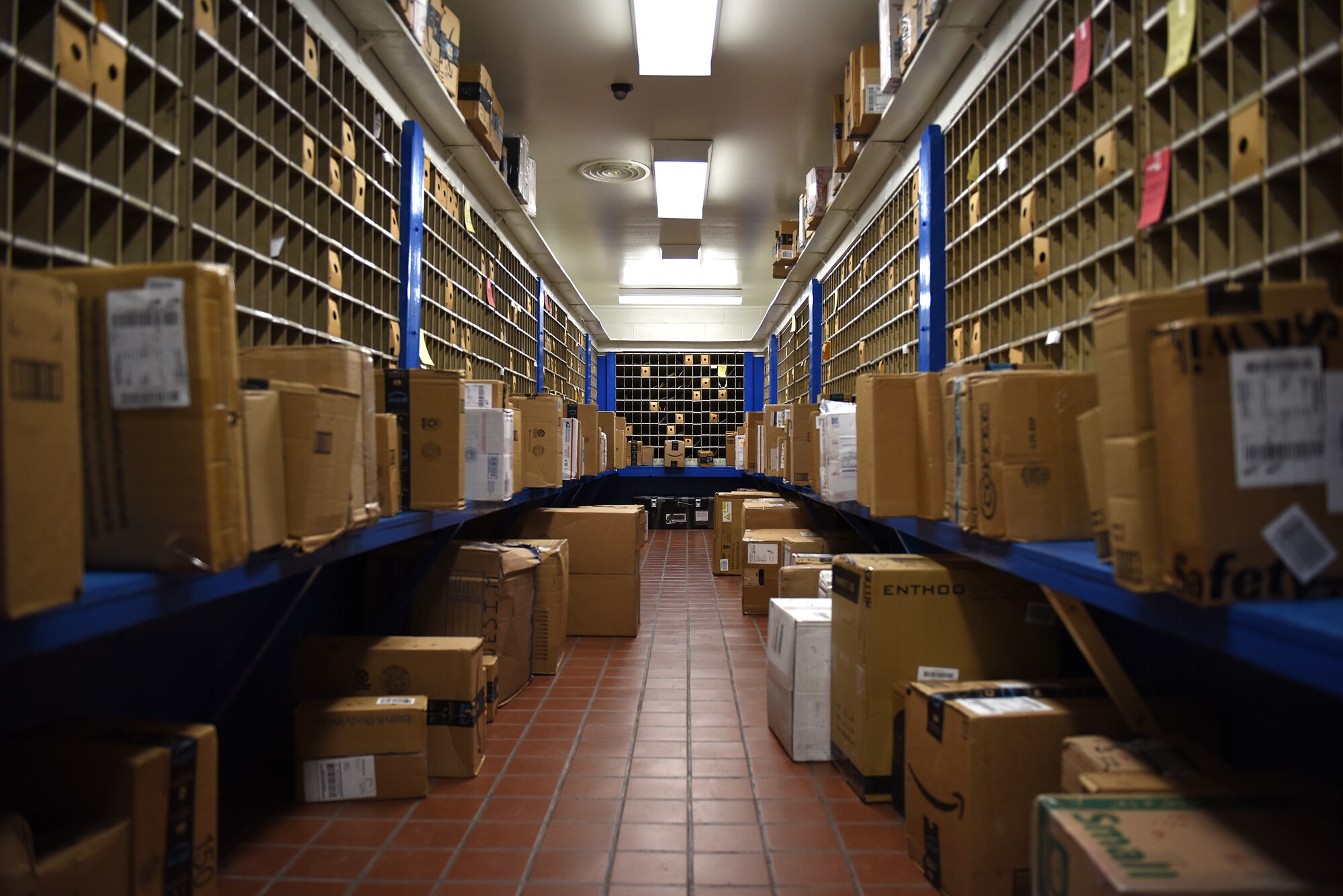 Packages sit inside the post office at Kunsan Air Base, Republic of Korea, Feb. 3, 2021. The post office receives packages six days a week to distribute mail to the members of Kunsan.
