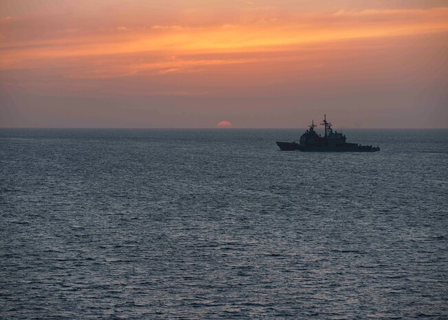 Guided-missile cruiser Port Royal (CG 73) transits the Strait of Hormuz, Feb. 8. Port Royal is deployed to the U.S. 5th Fleet area of operations in support of naval operations to ensure maritime stability and security in the Central Region, connecting the Mediterranean and Pacific through the western Indian Ocean and three strategic choke points.