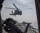 A MH-60R Sea Hawk helicopter, attached to Helicopter Maritime Strike Squadron (HSM) 49, takes off from the flight deck amphibious assault ship USS Makin Island (LHD 8) during a Strait of Hormuz transit, Feb. 8. The Makin Island Amphibious Ready Group and the 15th Marine Expeditionary Unit are deployed to the U.S. 5th Fleet area of operations in support of naval operations to ensure maritime stability and security in the Central Region, connecting the Mediterranean and Pacific through the western Indian Ocean and three strategic choke points. (U.S. Navy photo by Mass Communication Specialist 3rd Class Ethan Jaymes Morrow)