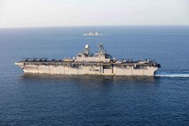 Amphibious assault ship USS Makin Island (LHD 8) and the embarked 15th Marine Expeditionary Unit (MEU) transit the Strait of Hormuz, Feb. 8. The Makin Island Amphibious Ready Group and the 15th MEU are deployed to the U.S. 5th Fleet area of operations in support of naval operations to ensure maritime stability and security in the Central Region, connecting the Mediterranean and Pacific through the western Indian Ocean and three strategic choke points. (U.S. Navy photo by Mass Communication Specialist 2nd Class Jacob D. Bergh)