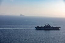 Amphibious assault ship USS Makin Island (LHD 8) and the embarked 15th Marine Expeditionary Unit (MEU) transit the Strait of Hormuz, Feb. 8. The Makin Island Amphibious Ready Group and the 15th MEU are deployed to the U.S. 5th Fleet area of operations in support of naval operations to ensure maritime stability and security in the Central Region, connecting the Mediterranean and Pacific through the western Indian Ocean and three strategic choke points. (U.S. Navy photo by Mass Communication Specialist 2nd Class Jacob D. Bergh)