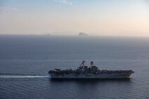 Amphibious assault ship USS Makin Island (LHD 8) and the embarked 15th Marine Expeditionary Unit (MEU) transit the Strait of Hormuz, Feb. 8. The Makin Island Amphibious Ready Group and the 15th MEU are deployed to the U.S. 5th Fleet area of operations in support of naval operations to ensure maritime stability and security in the Central Region, connecting the Mediterranean and Pacific through the western Indian Ocean and three strategic choke points. (U.S. Navy photo by Mass Communication Specialist 2nd Class Jacob D. Bergh)