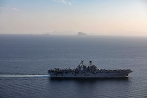 Amphibious assault ship USS Makin Island (LHD 8) and the embarked 15th Marine Expeditionary Unit (MEU) transit the Strait of Hormuz, Feb. 8. The Makin Island Amphibious Ready Group and the 15th MEU are deployed to the U.S. 5th Fleet area of operations in support of naval operations to ensure maritime stability and security in the Central Region, connecting the Mediterranean and Pacific through the western Indian Ocean and three strategic choke points. (U.S. Navy photo by Mass Communication Specialist 2nd Class Jacob D. Bergh)