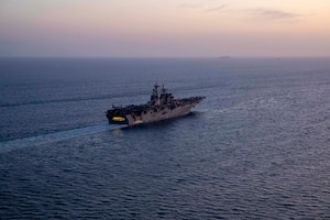 Amphibious assault ship USS Makin Island (LHD 8) and the embarked 15th Marine Expeditionary Unit (MEU) transit the Strait of Hormuz, Feb. 8. The Makin Island Amphibious Ready Group and the 15th MEU are deployed to the U.S. 5th Fleet area of operations in support of naval operations to ensure maritime stability and security in the Central Region, connecting the Mediterranean and Pacific through the western Indian Ocean and three strategic choke points. (U.S. Navy photo by Mass Communication Specialist 2nd Class Jacob D. Bergh)