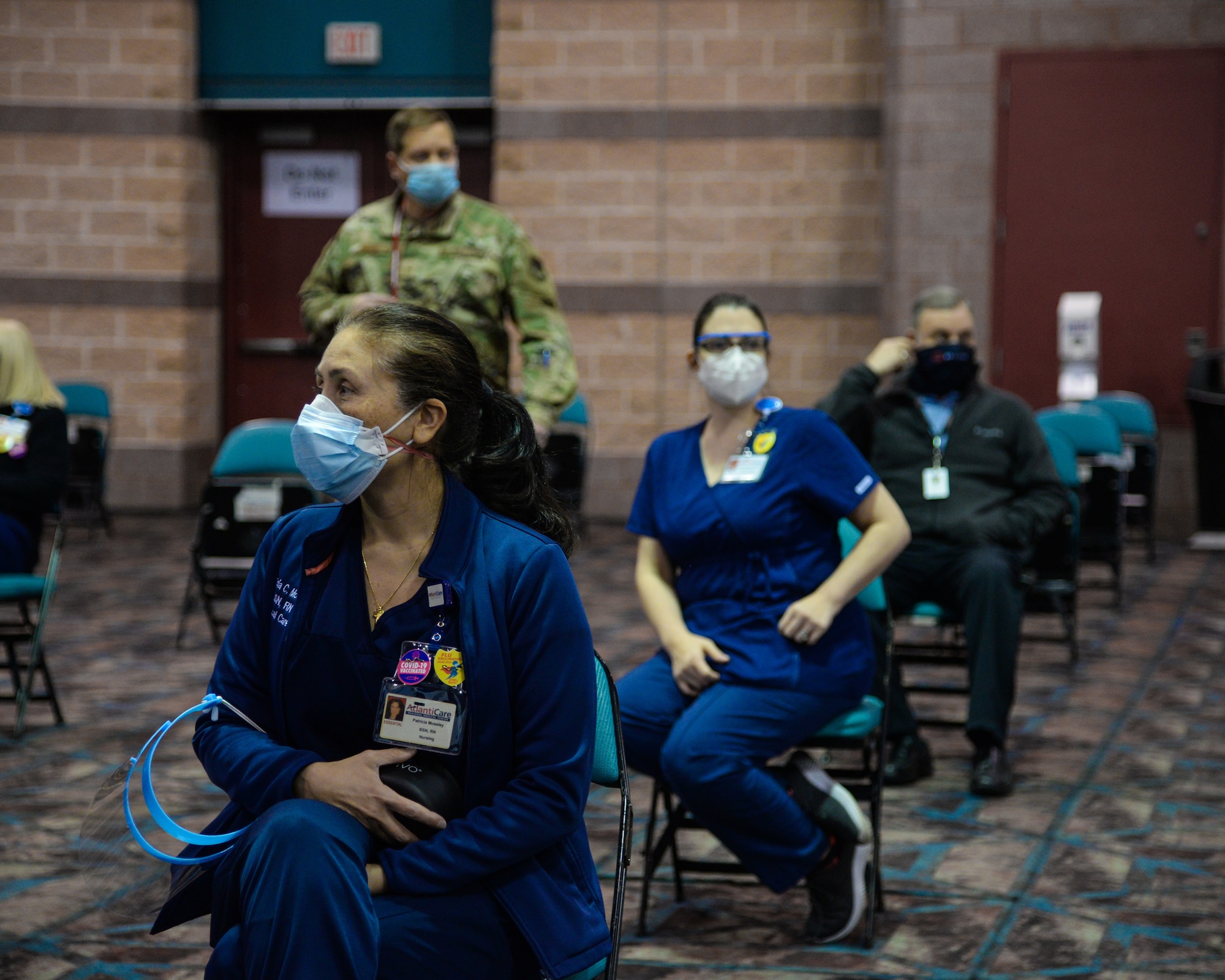 An image of NJ Air National Guard and AtlantiCare Regional Health Services members serving at the Atlantic City Convention Center, Atlantic City, N.J., to help the residents of New Jersey receive the COVID-19 vaccination at the Atlantic County Point Of Distribution mega-site.