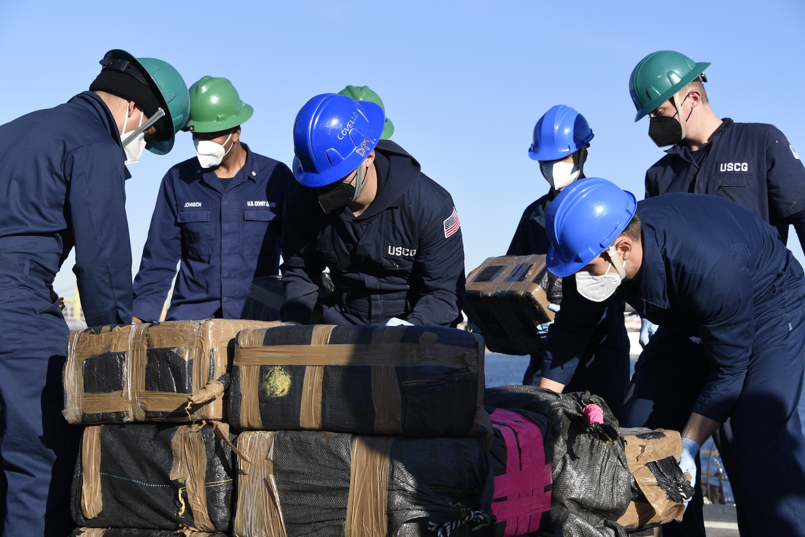 The Coast Guard Cutter Campbell (WMEC 909) crew offloads approximately 7,250 pounds of cocaine at Port Everglades, Florida, Feb. 4, 2021.